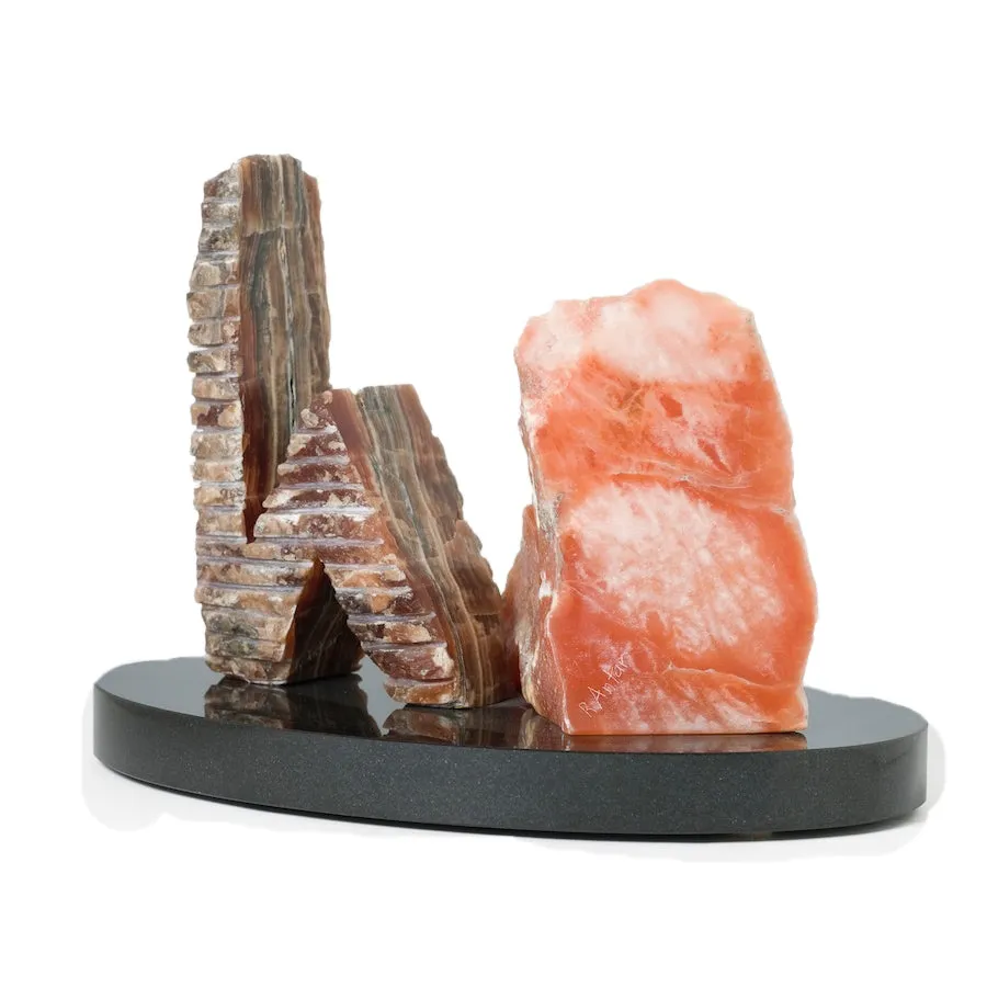 ONYX AND ALABASTER SCULPTURE BETWEEN A ROCK AND A HARD PLACE